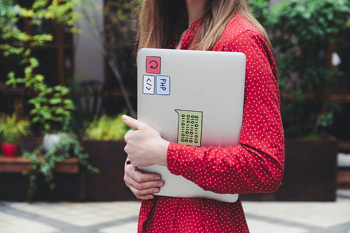 Woman holding a Macbook
